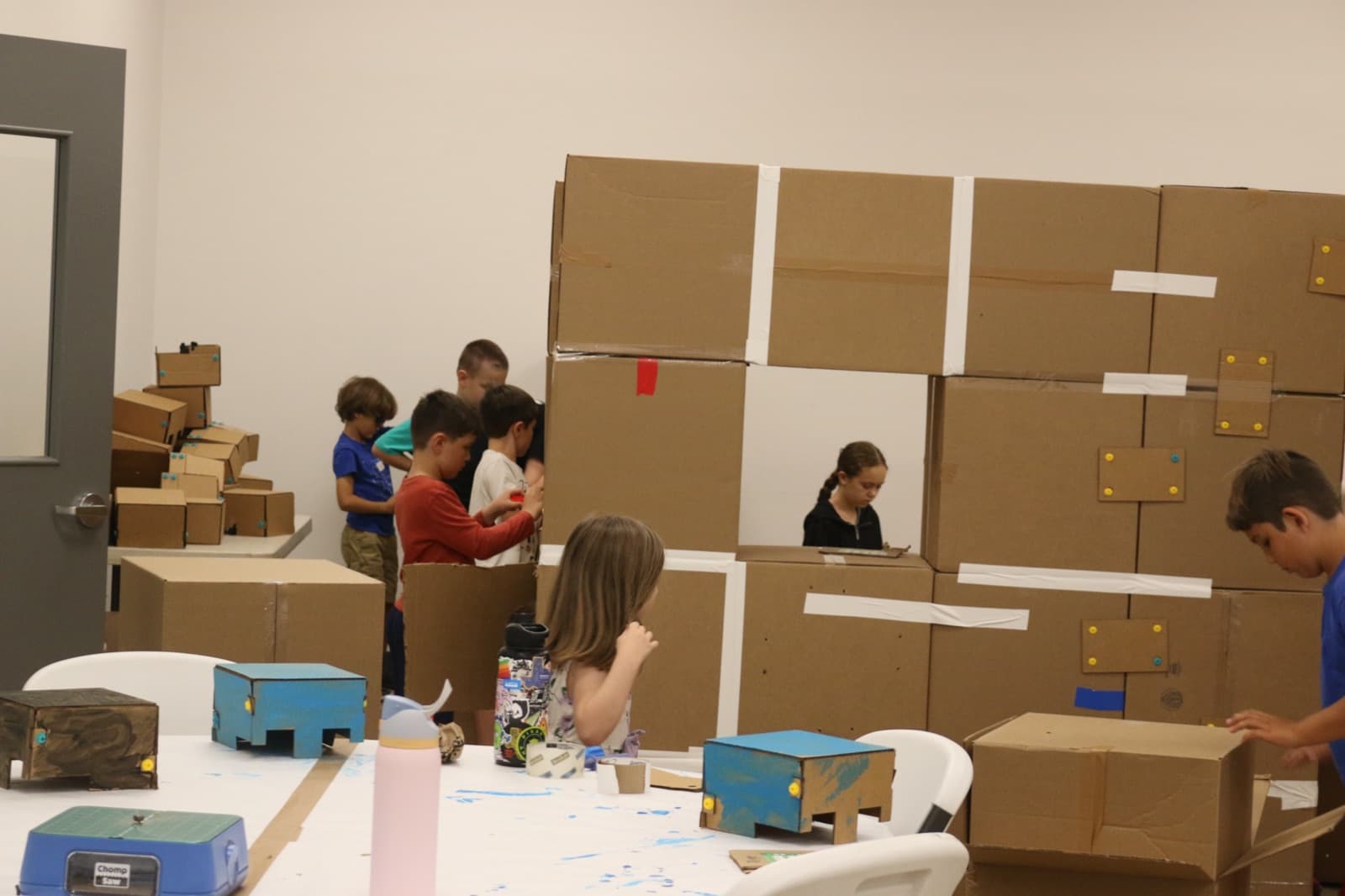The whole room mid-build as a cardboard fort wall takes shape